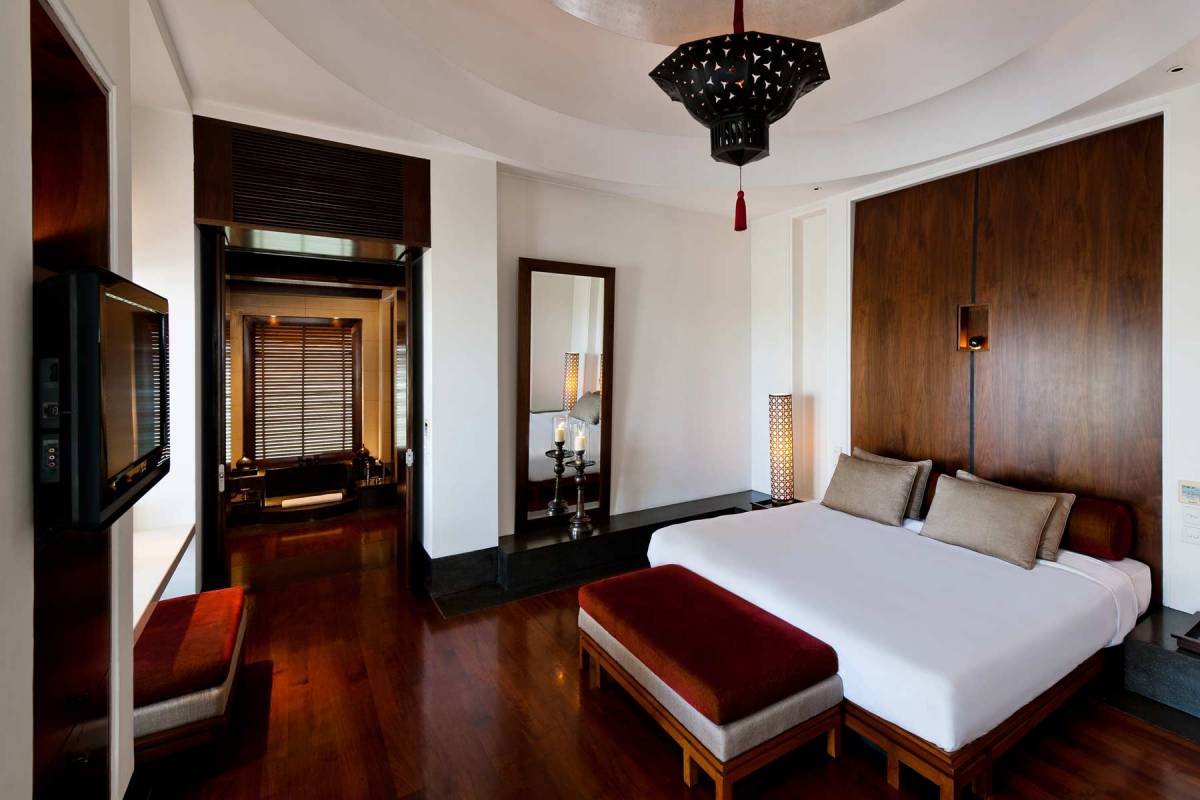 View into the bedroom of one of the Club Suites at The Chedi Muscat